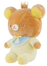 As if Rilakkuma didn't already capture all of our hearts, we now get to cuddle up with this ultra-soft and adorable Big Baby Rilakkuma Pajama Onesie Plushie! This plush toy features Rilakkuma dressed in a cozy, pastel yellow pajama onesie, complete with a cute blue bib with an embroidered bunny on it, perfect for nap time and hugs. 
