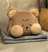 Cushion cozies are perfect for chilly days! This multifunctional plushie combines the softness of a huggable pillow with the coziness of a built-in hand warmer, all in an adorable cat design. 
Shaped like a charming brown bear with sweet embroidered details, it’s perfect for cat lovers of all ages. High quality and well constructed to keep its shape for a long time, you can also tuck your hands into the hidden pocket for instant warmth and cozy relaxation.