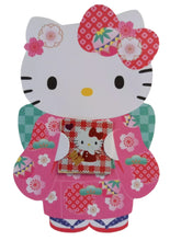 This elegant Hello Kitty "pochibukuro" envelope set combines classic Japanese beauty with adorable charm. Featuring Hello Kitty dressed in a traditional kimono in vibrant but soft pinks and greens. Also known as red envelopes and often given on New Year's Day, this envelope set is perfect for giving small cash gifts, messages, or gift cards for all sorts of special occasions.
The intricate kimono design highlights delicate patterns and vibrant colors that add an extra layer of sophistication. Made with qua