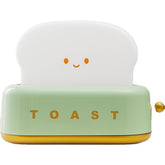 Brighten up your space with the Kawaii Design Toaster Table Lamp, a delightful and quirky decor piece for any room! Shaped like an adorable toaster, this lamp emits a warm, cozy glow from “toast slices." Its cute, playful design combines functionality with a touch of charm, perfect for adding a unique accent to desks, bedside tables, or cozy nooks.
Made with high-quality materials and LED lighting, it’s energy-efficient and easy on the eyes. A must-have for fans of all things carby and kawaii!