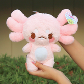 Maxolotl the Axolotl Plushie is the plushie for the discerning axolotol fan. Soft and huggable, he's the perfect companion for all your adventures - whatever they may be! His embroidered face is so cute, you won't be able to resist catching him and giving him a squeeze! (Ssssh, don't tell the other plushies).