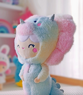 She’s dino-mighty! Each Momiji Roarsome Rainbow Dinosaur Plushie is unique. Her pastel rainbow pattern is positioned differently on each dinosaur, so there’ll never be another exactly like yours anywhere in the world.  Featuring super soft plush fabric and embroidered details.  Soft, huggable, iconic characters. 