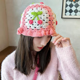 Add a touch of granny-chic sweetness to your wardrobe with our handcrafted crocheted bucket hat! This delightful pink accessory features adorable cherry details, perfectly blending vintage charm with kawaii style. This is a snug fit of a classic bucket hat silhouette with a bit of ruffled edges!