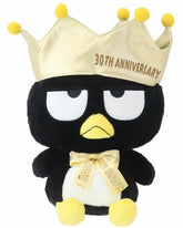 An amazing tribute to one of Sanrio's bad boys, the incomparable Bad Badtz Maru! The King Bad Badtz Maru 30th Anniversary Plushie showcases Badtz in a regal, yet cheeky look befitting his mischievous personality. He sports a well-deserved golden crown and bow tie, making him the true king of attitude.