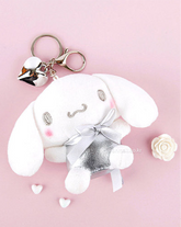 The Silver Glam Cinnamoroll Plush Keychain is a fashion-forward and enchanting accessory that brings a welcomed sparkle to your everyday life. This plush keychain features the beloved Cinnamoroll character, in a two-toned stylish look, made with shimmering silver fabric that adds a glamorous flair.
Made from soft, high-quality materials, it offers a delightful tactile experience while being durable enough for daily use. Its compact size makes it perfect for attaching to keys, bags, or backpacks.