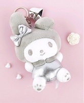The Silver Glam My Melody Plush Keychain is a fashion-forward and enchanting accessory that brings a welcomed sparkle to your everyday life. This plush keychain features the beloved My Melody character, in a two-toned stylish look, made with shimmering silver fabric that adds a glamorous flair.
Made from soft, high-quality materials, it offers a delightful tactile experience while being durable enough for daily use. Its compact size makes it perfect for attaching to keys, bags, or backpacks.