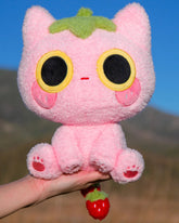 Soft, silly, and full of love, Strawmi is boutique designer MikouArt's sweetest design! Strawmi’s iconic strawberry head and tail are made with custom materials and sewing techniques. Two tiny, movable strawberries on the tail add some extra playful charm. Strawberries are the essential kawaii fruit for good reason- Strawmi makes the perfect unique gift for fans and collectors of all things strawberry-themed!