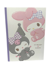 Adorned with lovely illustrations, the Sweet Winking Kuromi & My Melody Notebook sparks creativity and imagination on every page. Whether for jotting down thoughts or sketching dreams, this notebook is a charming companion for Sanrio fans writing from their classrooms or offices!
