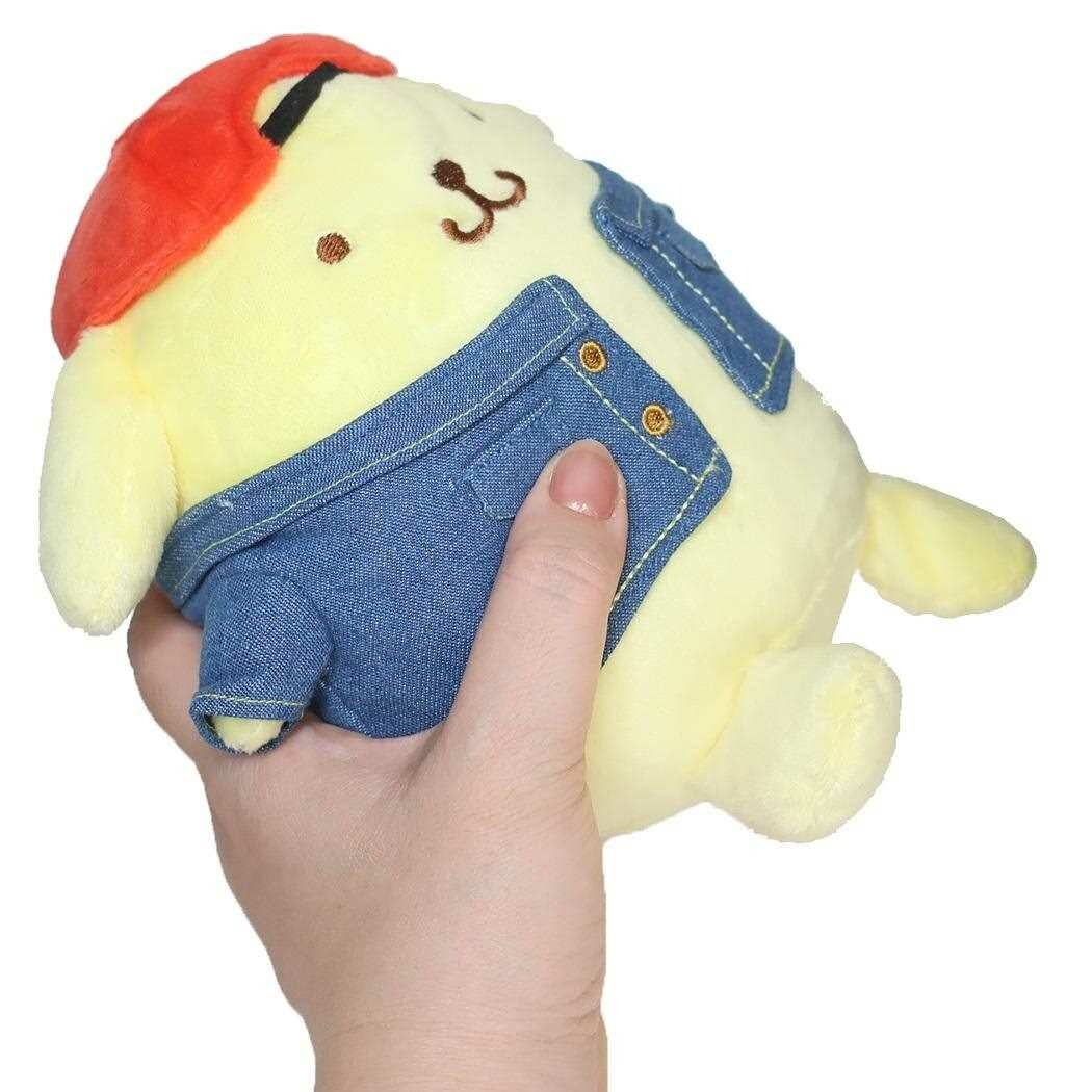 Jump back to the golden age of kawaii with our 90s Style Throwback Retro Pompompurin Plushie! This nostalgic version of Sanrio's beloved golden retriever pup captures all the vintage vibes while keeping his signature charm. Featuring Pompompurin in a retro-inspired outfit- a red backwards baseball hat and jean jacket, this plushie perfectly embodies the sweet spirit of 90s kawaii culture. Whether you're a long-time fan or new to collecting, this huggable piece of nostalgia brings together the best .
