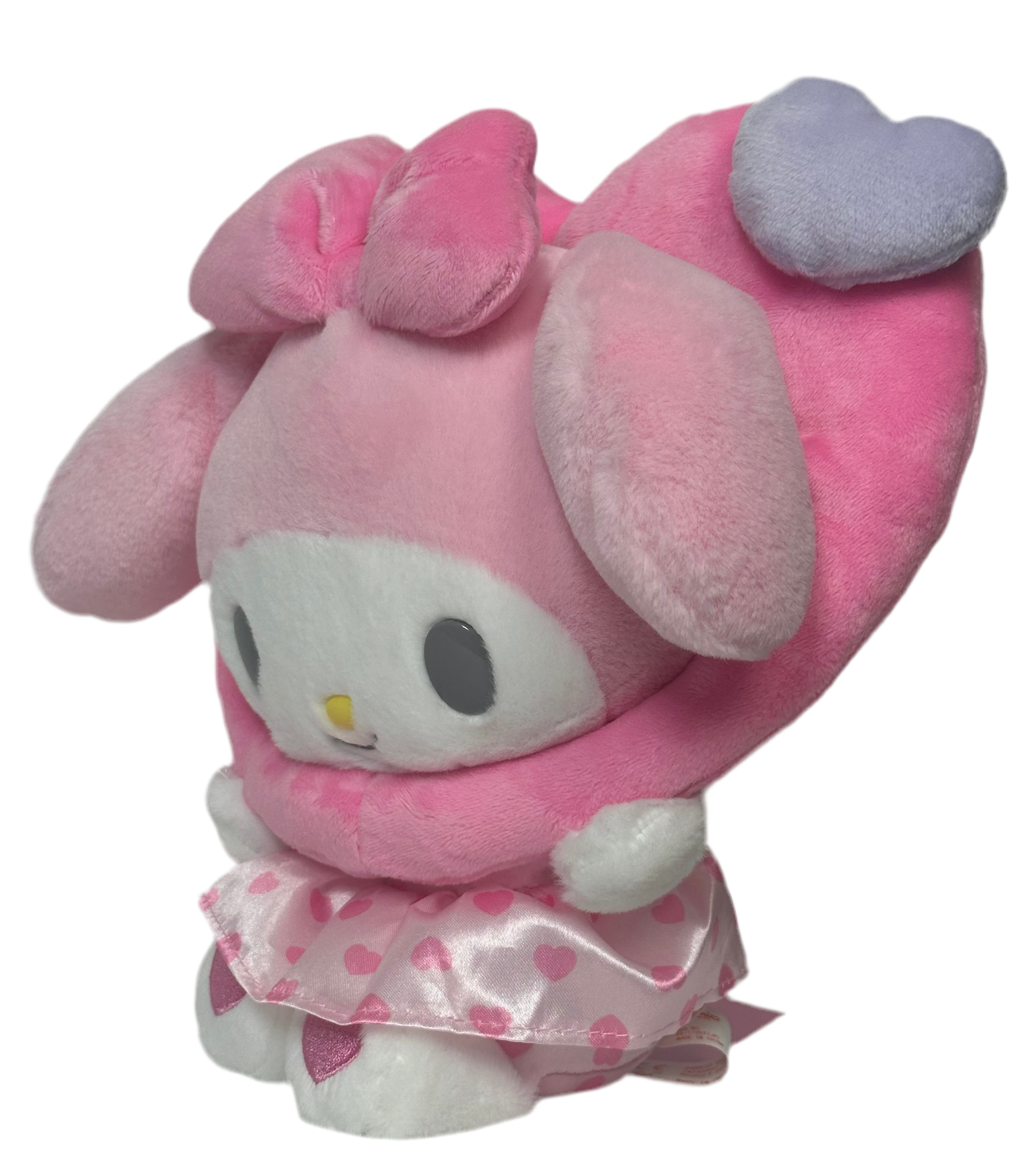 This adorable All Love My Melody Colorful Hearts Pink Plushie features a baby-like cuteness design that is simply irresistible. Its delightful appearance is sure to bring a smile to your face.

The wreathed heart around My Melody's head makes his smile even sweeter and snugglier. This charming detail adds an extra touch of warmth and love to the Sanrio plushie. You'll love cuddling up with this soft and huggable friend.