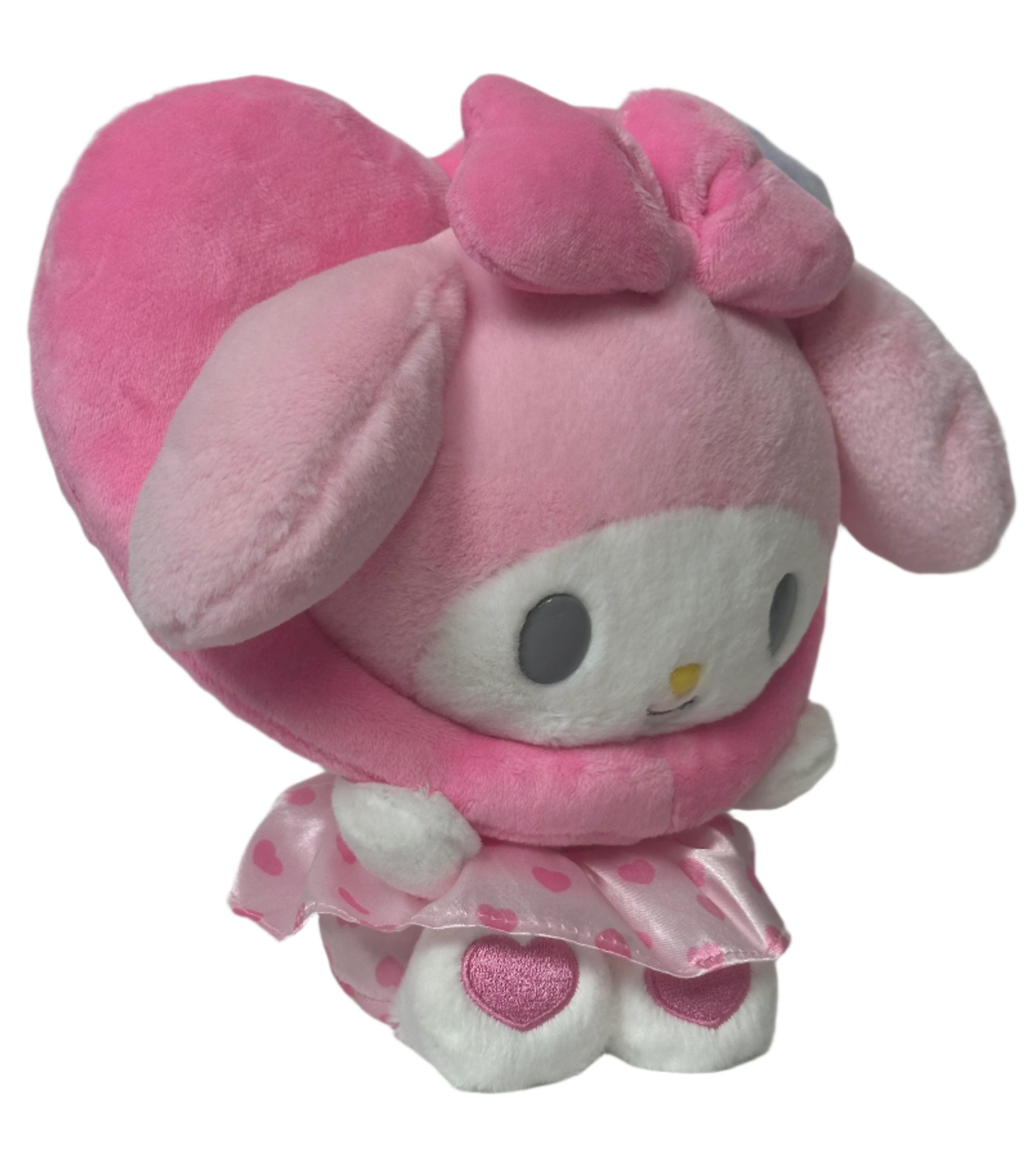 This adorable All Love My Melody Colorful Hearts Pink Plushie features a baby-like cuteness design that is simply irresistible. Its delightful appearance is sure to bring a smile to your face.

The wreathed heart around My Melody's head makes his smile even sweeter and snugglier. This charming detail adds an extra touch of warmth and love to the Sanrio plushie. You'll love cuddling up with this soft and huggable friend.