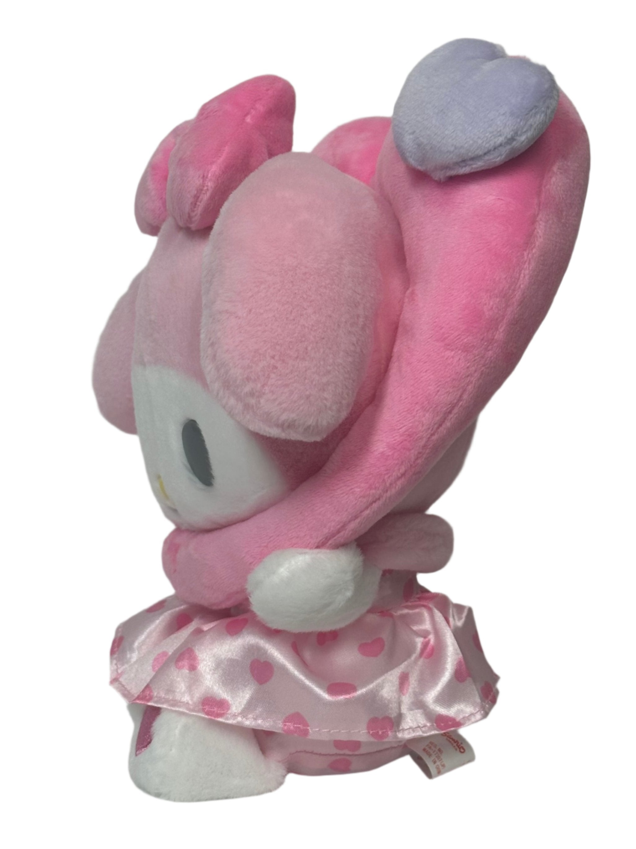 This adorable All Love My Melody Colorful Hearts Pink Plushie features a baby-like cuteness design that is simply irresistible. Its delightful appearance is sure to bring a smile to your face.

The wreathed heart around My Melody's head makes his smile even sweeter and snugglier. This charming detail adds an extra touch of warmth and love to the Sanrio plushie. You'll love cuddling up with this soft and huggable friend.