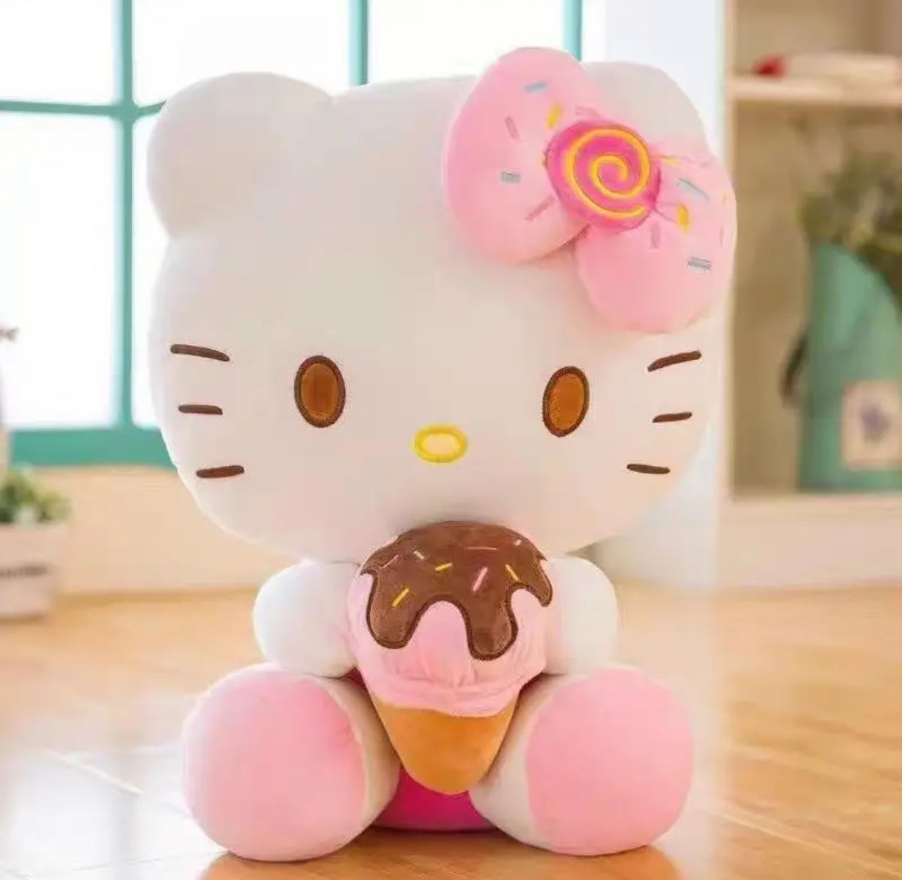 Sweeten your collection with the Big Hello Kitty Ice Cream Sprinkles Cone Plushie! This oversized plush features Hello Kitty embracing a delicious-looking ice cream cone, complete with vibrant pink sprinkles her signature pink bow with more sprinkles and a cute candy center!

Made with super-soft, high-quality materials, it’s perfect for cozy cuddles and adds a fun, playful vibe to any room. With a delightful mix of cuteness and sweetness, this plushie is a must-have for Hello Kitty fans and dessert lovers 