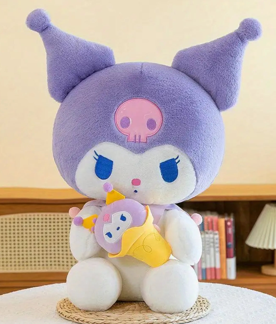 Sweeten your collection with the Big Kuromi Ice Cream Cone Plushie! This oversized plush features Kuromi embracing a delicious-looking ice cream cone, which happens to be a scoop of her purple sidekick Baku the Tapir!&nbsp;

Made with super-soft, high-quality materials, it’s perfect for cozy cuddles and adds a fun, playful vibe to any room. With a delightful mix of cuteness and sweetness, this plushie is a must-have for Kuromi and dessert lovers alike!