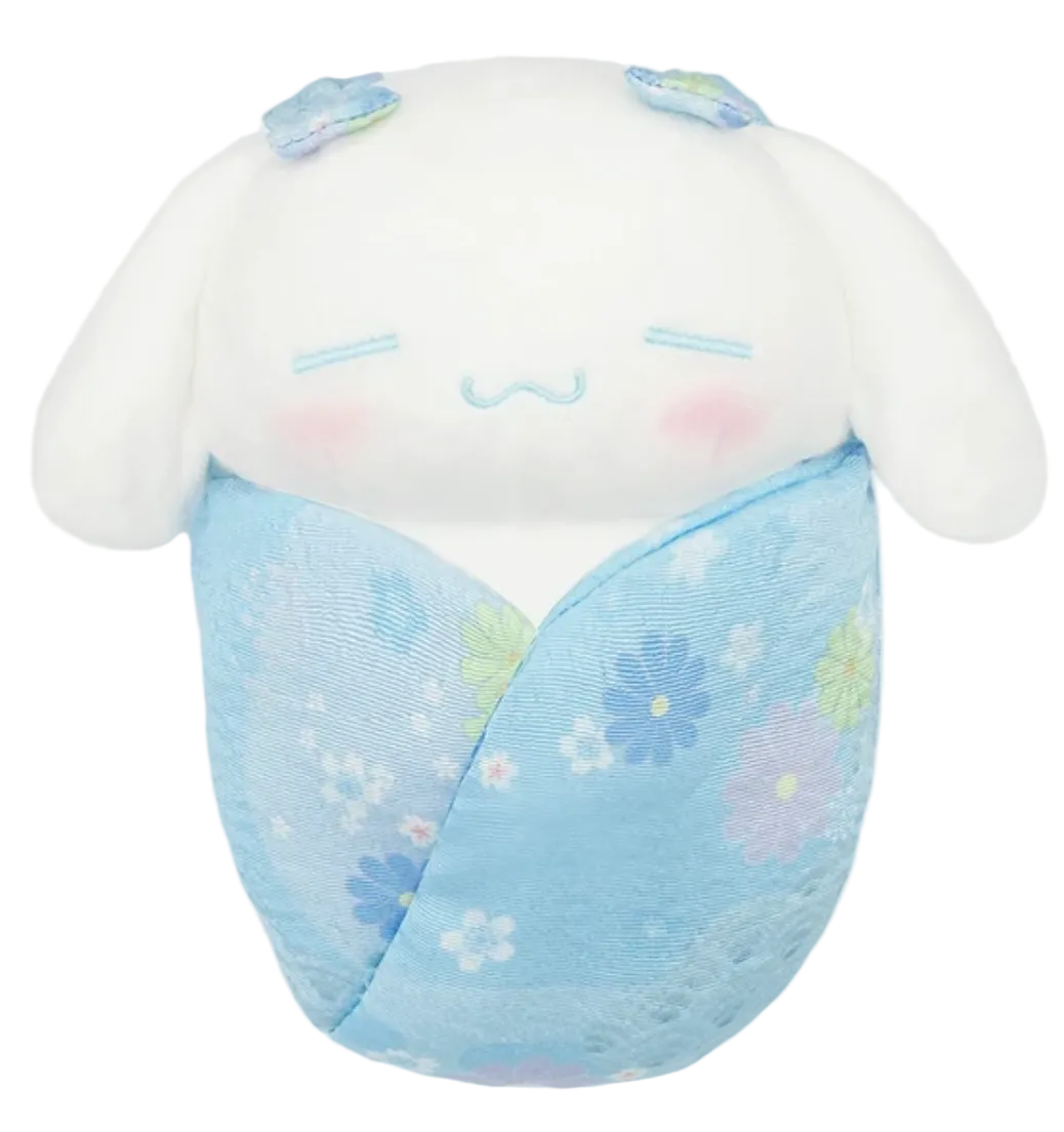 This adorable Cinnamoroll plushie combines a traditional blue kimono style with a cozy swaddle design for an irresistibly cute look. Its soft texture and detailed features make it perfect for cuddling or displaying on a bed, shelf, or desk.