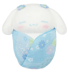 This adorable Cinnamoroll plushie combines a traditional blue kimono style with a cozy swaddle design for an irresistibly cute look. Its soft texture and detailed features make it perfect for cuddling or displaying on a bed, shelf, or desk.
