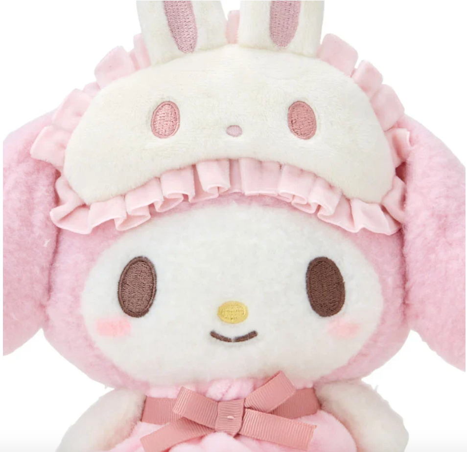 Sanrio's sweetheart favorite, My Melody, is stylishly ready for bed! The Bow Pajamas + Bunny Sleep Mask My Melody Plushie features a pink center bow, ruffled nightie, and an attached bunny-shaped sleep mask. Soft fabrics make this huggable plush perfect for nighttime snuggles.


A comforting friend perfect for winding down. A nice pairing if you're assembling a spa-day gift basket. A solid addition to any plushie or My Melody collection. Relax with the calming colors, friendly, embroidered face and just gen