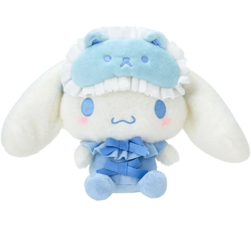 Sanrio's friendly favorite, Cinnamoroll, is stylishly ready for bed! The Bow Pajamas + Mascot Sleep Mask Cinnamoroll Plushie features two center bows and an attached bear-shaped sleep mask. Soft fabrics make this huggable plush perfect for nighttime snuggles.


A comforting friend perfect for winding down. A nice pairing if you're assembling a spa-day gift basket. A solid addition to any plushie or Cinnamoroll collection. Relax with the calming colors, friendly, embroidered face and just general squishabili