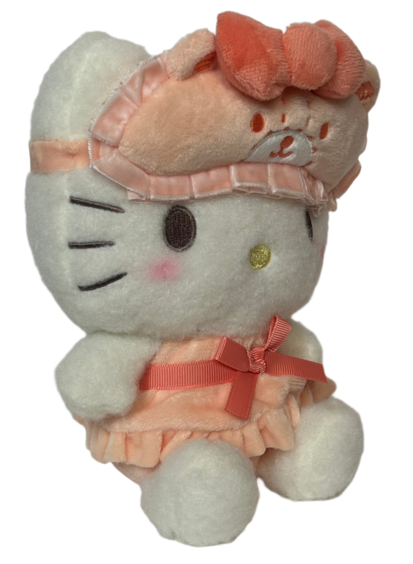 Sanrio's classic favorite, Hello Kitty, is stylishly ready for bed! The Bow Pajamas + Mascot Sleep Mask Hello Kitty Plushie features a center bow on both top and bottom, ruffled nightie, and an attached bear-shaped sleep mask. Soft fabrics make this huggable plush perfect for nighttime snuggles.