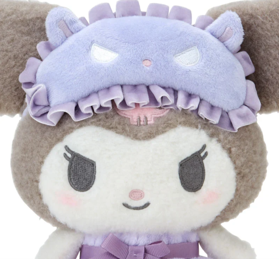 Sanrio's feisty favorite, Kuromi, is stylishly ready for bed! The Bow Pajamas + Mascot Sleep Mask Kuromi Plushie features a sweet center bow, ruffled nightie and an attached tapir-shaped sleep mask (It's Baku!) Soft fabrics make this huggable plush perfect for nighttime snuggles.


A comforting friend perfect for winding down. A nice pairing if you're assembling a spa-day gift basket. A solid addition to any plushie or Kuromi collection. Relax with the calming colors, friendly, embroidered face and just gen