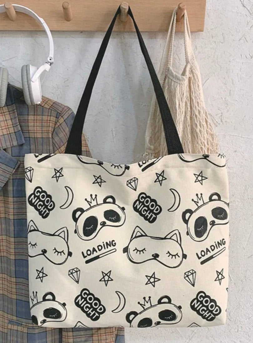 Our Celestial Sleepover Fox &amp; Panda Canvas XL Tote is adorned with a delightful array of diamonds, stars, moons, and the cutest panda and fox sleep masks, this tote is not just a carrier but a statement piece! Crafted with durable materials, it offers ample space to carry your essentials while keeping your style on point. A very sweet yet kawaii street style!