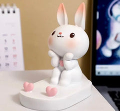 This charming holder showcases an adorable bunny with a cheerful expression, making it a delightful addition to your bedside table or desk for effortless calls and enjoyable music sessions, so kawaii!