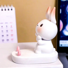 This charming holder showcases an adorable bunny with a cheerful expression, making it a delightful addition to your bedside table or desk for effortless calls and enjoyable music sessions, so kawaii!