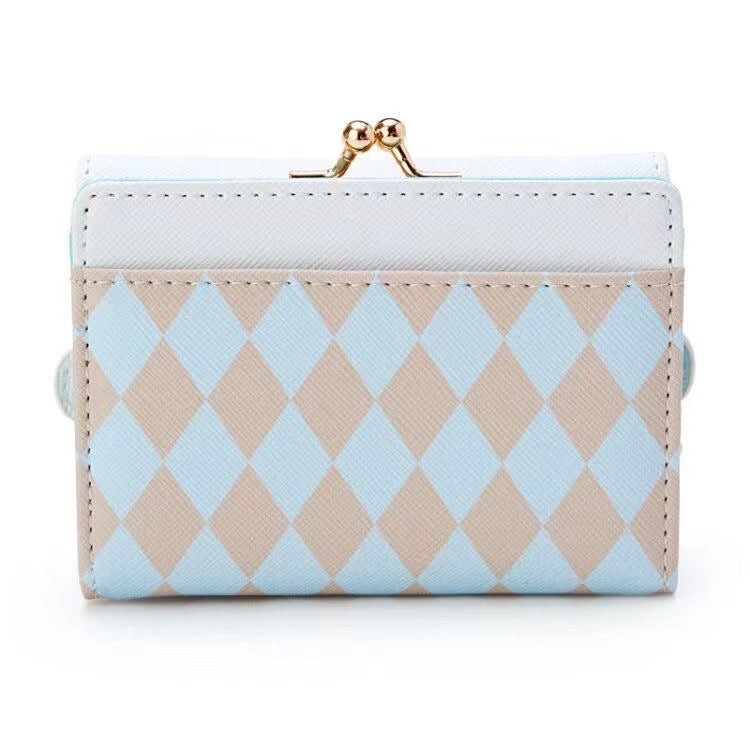 Add a touch of adorable charm to your daily essentials with this Cinnamoroll Face Baby Blue Diamond Print Wallet! Perfect for fans of the beloved Sanrio character, Cinnamoroll, this wallet is as functional as it is cute.

Featuring Cinnamoroll in a classy but fun baby blue diamond design, the wallet is accented with a stylish gold clasp, giving it a chic, feminine look.

Made from durable synthetic leather, with multiple compartments for cards, cash, and coins.