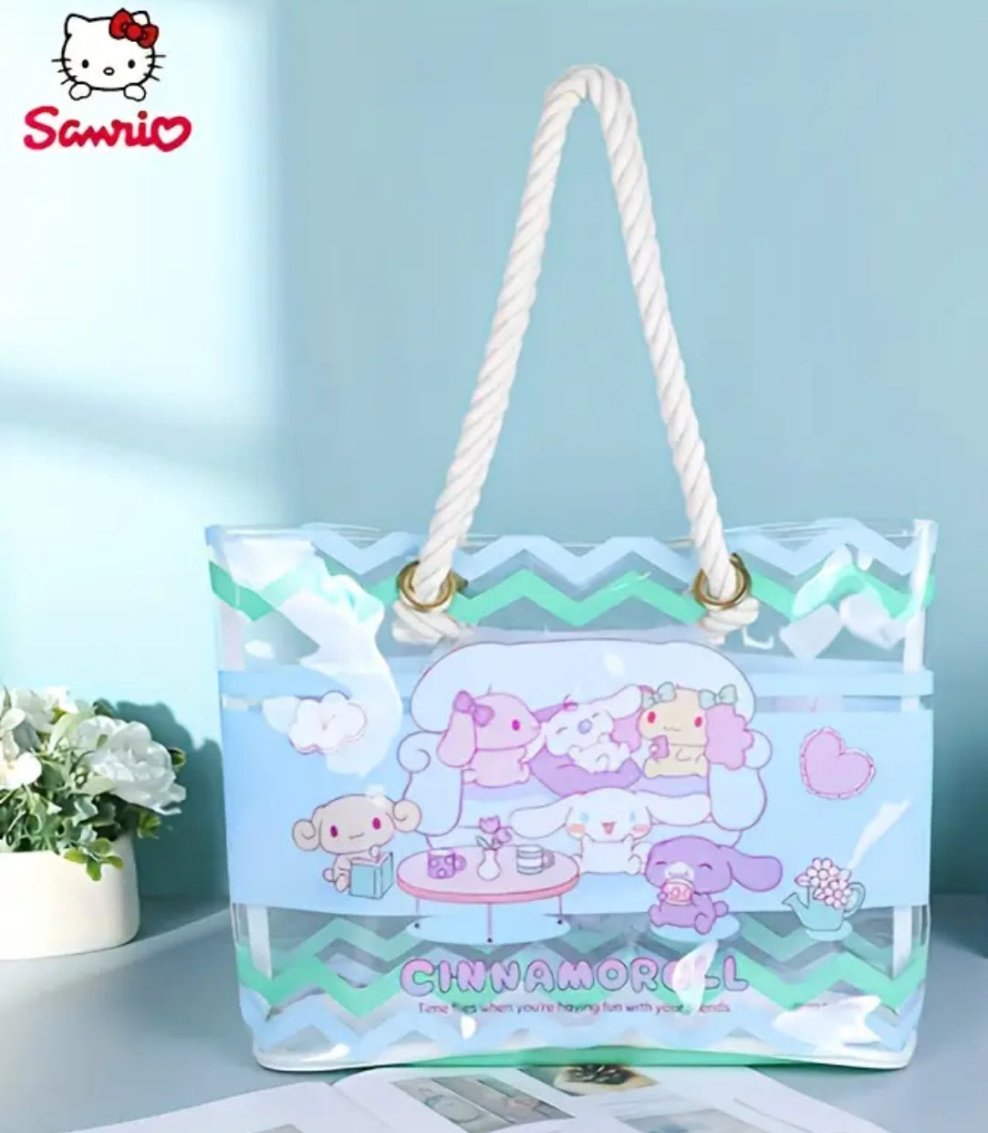 The transparent Cinnamoroll &amp; Friends Clear Shoulder Bag featuring a trendy rope handle and showcases everyone’s favorite floppy-eared pup, Cinnamoroll, with soft pastel details and an airy, see-through design to display your essentials in style. The durable, clear PVC material keeps your items safe while adding a fun, modern twist to your accessories.&nbsp;The message "Time flies when you’re having fun with your friends" as Cinnamoroll lounges at home with his pals is endearing and super relatable!