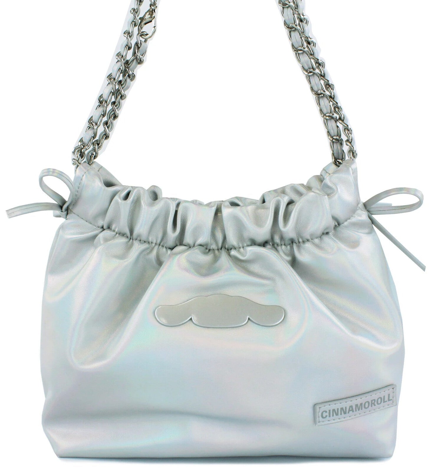 Class and shine meets everyday style with our Cinnamoroll Silver Metallic Ribbon Shoulder Bag! This limited edition bag features a stunning silver metallic finish adorned with elegant ribbon details and adorable Cinnamoroll charm. The practical drawstring cinch closure keeps your belongings secure while maintaining easy access. Perfectly sized for daily essentials and featuring a comfortable shoulder strap, this bag combines functionality with kawaii flair. 