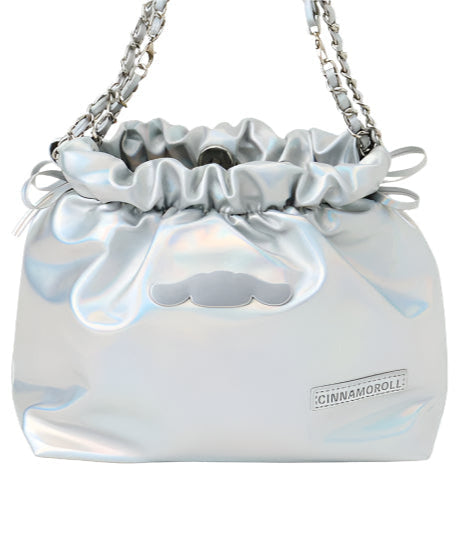 Class and shine meets everyday style with our Cinnamoroll Silver Metallic Ribbon Shoulder Bag! This limited edition bag features a stunning silver metallic finish adorned with elegant ribbon details and adorable Cinnamoroll charm. The practical drawstring cinch closure keeps your belongings secure while maintaining easy access. Perfectly sized for daily essentials and featuring a comfortable shoulder strap, this bag combines functionality with kawaii flair. 