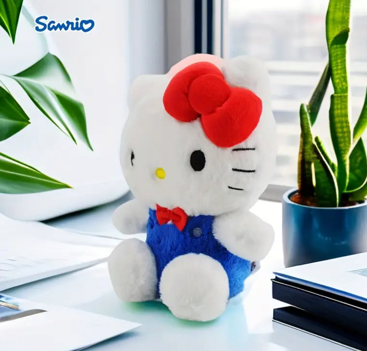 Celebrate 50 years of Sanrio princess with this adorable, classic Hello Kitty plushie. Here she is dressed in her iconic blue overalls and signature red bow. Hello Kitty's sweet face and timeless design make her a cherished collectible for fans of all ages.&nbsp;

Standing at just the right size for hugs and carrying around, she brings a sense of nostalgia and charm to any space. A must-have addition to any Hello Kitty or Sanrio collection!