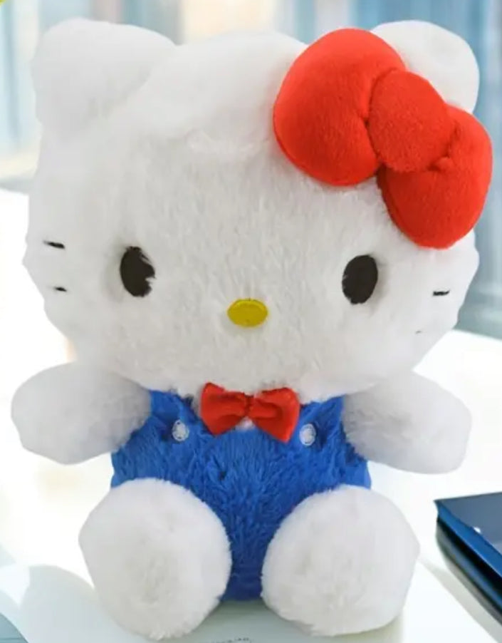 Celebrate 50 years of Sanrio princess with this adorable, classic Hello Kitty plushie. Here she is dressed in her iconic blue overalls and signature red bow. Hello Kitty's sweet face and timeless design make her a cherished collectible for fans of all ages.&nbsp;

Standing at just the right size for hugs and carrying around, she brings a sense of nostalgia and charm to any space. A must-have addition to any Hello Kitty or Sanrio collection!