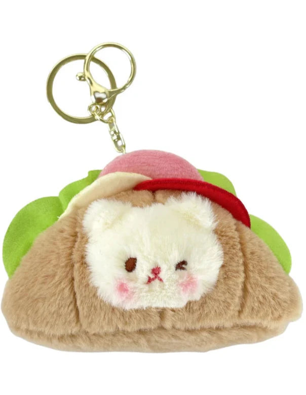 This little guy adds a dose of cute to your everyday carry with the Croissant Sandwich Bear Plush Keychain! This irresistibly cute accessory features a tiny, soft bear atop a buttery croissant sandwich, with all the fixin's. Perfect for fans of food-inspired designs, sandwich lovers, and all things bear-y-licious, this keychain brings all the kawaii charm.