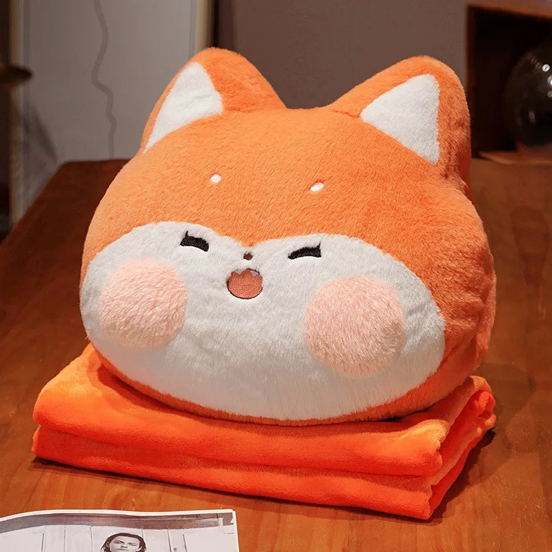 Cushion cozies are perfect for chilly days! This multifunctional plushie combines the softness of a huggable pillow with the coziness of a built-in hand warmer, all in an adorable cat design.&nbsp;

Shaped like a charming fox with sweet embroidered details, it’s perfect for animal lovers of all ages. High quality and well constructed to keep its shape for a long time, you can also tuck your hands into the hidden pocket for instant warmth and cozy relaxation.