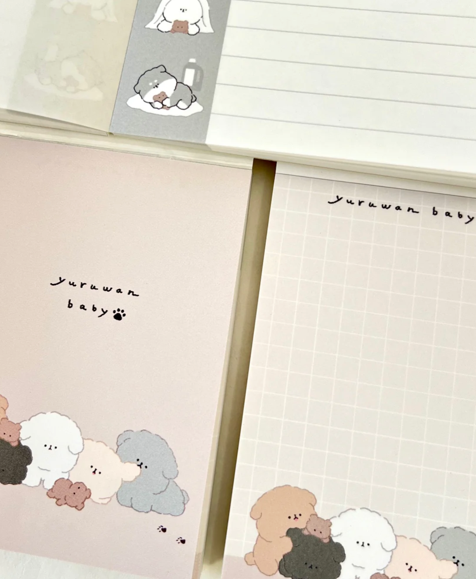 ‘Yuruwan’ is a gang of laid-back dogs, now in a lovable pile on these handy notepads.  These Dog Pile Kawaii Mini Notepads feature two different designs, printed in full color. Quality binding, yet easy tear-out sheets.