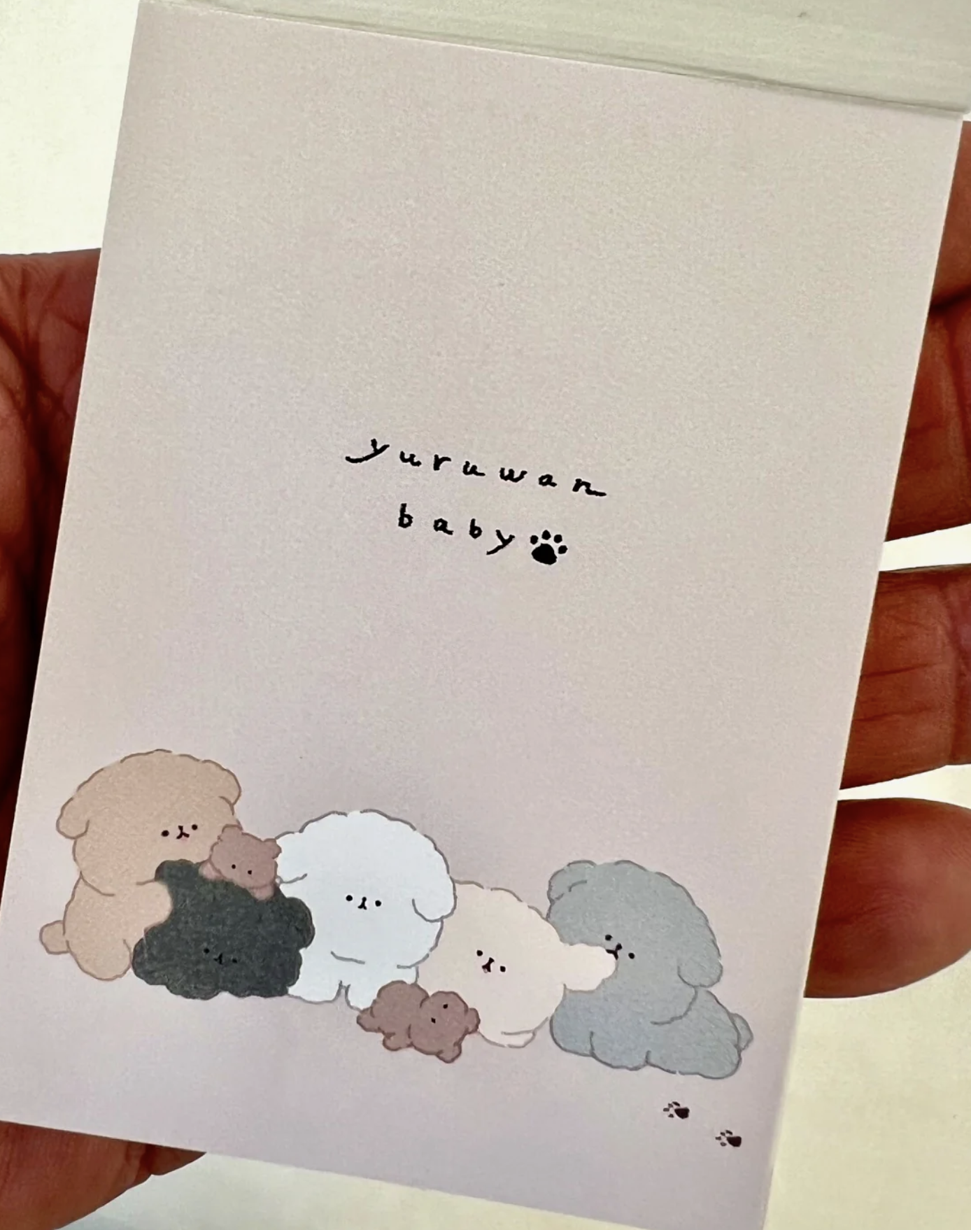 ‘Yuruwan’ is a gang of laid-back dogs, now in a lovable pile on these handy notepads.  These Dog Pile Kawaii Mini Notepads feature two different designs, printed in full color. Quality binding, yet easy tear-out sheets.