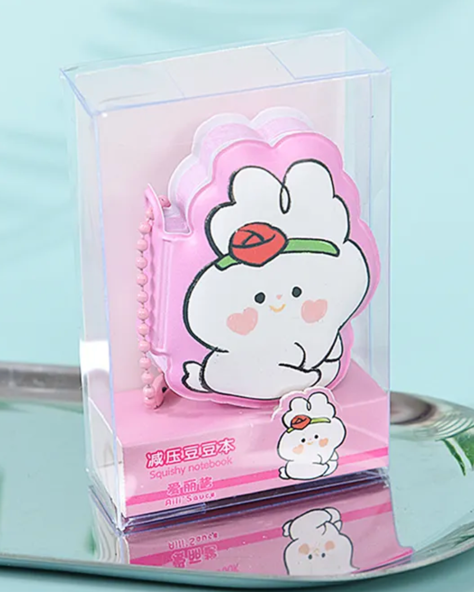 Bounce into this Doodle Bunny Mini Puffy Notebook—it's so cute and puffy! Its exterior features adorable illustrations of doodled bunnies with sweet rosy heart-shaped cheeks. They are available in four colors: pink, green, blue, and purple, and can be purchased in a full set of four!