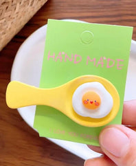 The Egg Spoon Kawaii Hair Clip exists today as an evolved and funky fashion statement, the result of an adorable trend. Eggs went right ahead and made their debut in the kawaii fashion world in recent years and, all over the globe, onlookers gave their approval.&nbsp;