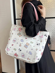 Fun, cute, and functional, this Everything Kawaii Print Shoulder Bag is a delightful bag featuring an enchanting all-over print. Showcasing adorable characters and designs: a playful panda, a cheerful bunny holding a carrot, a cuddly teddy bear, a narwhal with a magical horn, an all sorts of other whimsically happy delights!

This bag is perfect for school, work, or casual outings and is made from durable, nylon fabric with a soft pastel finish. It’s both stylish and practical with the double shoulder strap