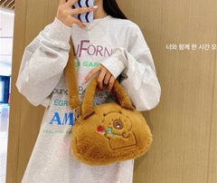 Fluffy Capybara Crossbody Purse! This kawaii bag resembling the body of the beloved capybara will earn you admiring glances wherever you go. The design features an embroidered capybara with a cheerful expression, holding out a flower—purely irresistible cuteness!