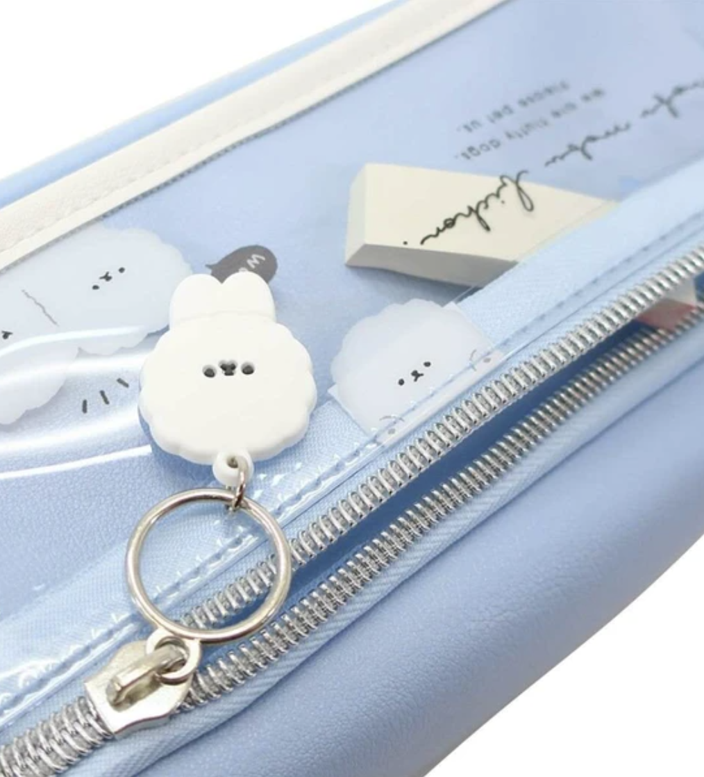 This adorable Fluffy Cloud Dog Pencil Case is perfect for keeping all your study essentials in one place. The sky-blue color and fluffy dog design add a fun and lighthearted touch to any drab study environment. Whether you want to give it as a gift or treat yourself, this cute pencil case will surely bring a smile to anyone's face!