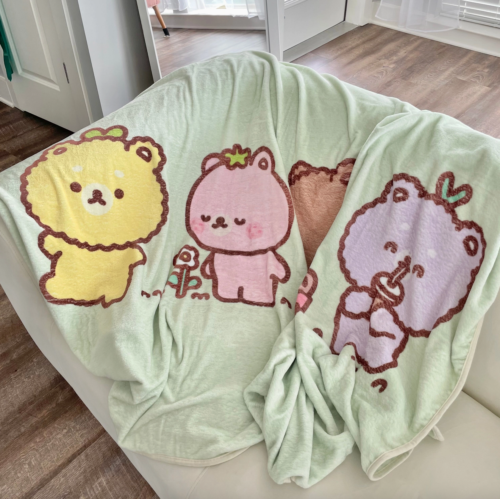 Wrap yourself in the cuddly charm of this Fluffy Bear Fleece Blanket! Illustrated with adorably plump bears by artist Chi Chi Little, this cozy blanket transforms any nap into a delightful experience.   Perfectly sized for a road trip snooze or a cozy night at home, it's the ultimate accessory for happy, restful moments. Boutique Kawaii