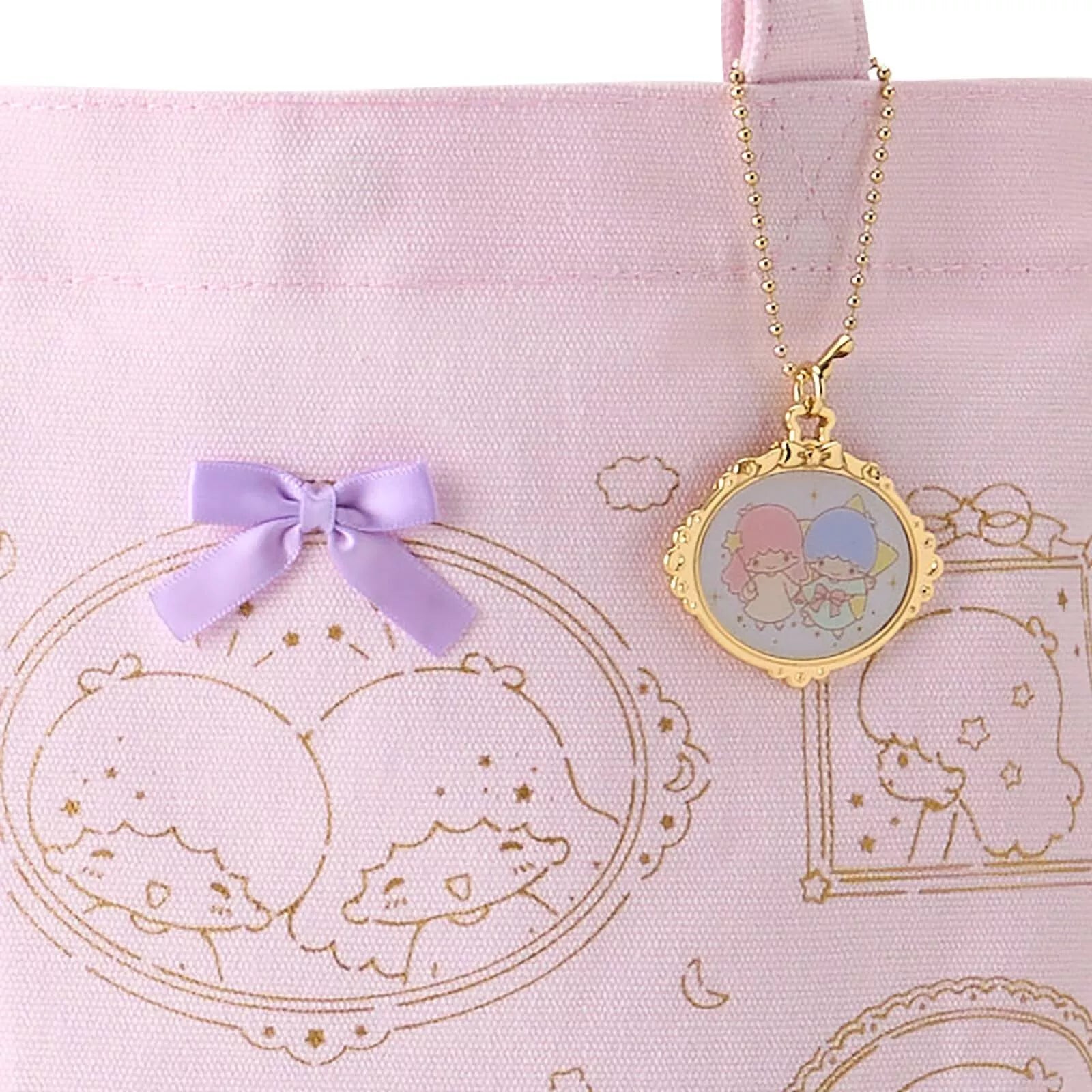 This amazing tote bag features our favorite Sanrio duo in a sweet theme; the inseparable two are shown in various expressions inside lovely ornate frames, and printed in a gold ink. The Forever Memories Little Twin Stars Tote comes with a coordinating gold charm that you can remove, and is adorned with three perfectly sweet and perfectly placed bows for a pop of color and charm.

This tote gives an effortless style, a mix of nostalgia with an air of casual class. A special addition to the kawaii closet.