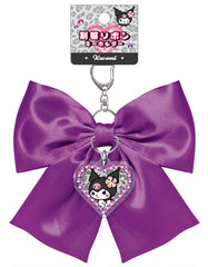 Elevate your everyday style with our Glam Kuromi Satin Bow Keychain in deep purple! This elegant accessory perfectly combines Sanrio's iconic charm with glam design elements. The stunning deep purple satin bow is complemented by a special centerpiece; a sparkling Kuromi acrylic charm that adds an extra touch of kawaii flair. Built with quality in mind, this keychain features a durable metal attachment that makes it perfect for your keys, bags, or starting your Sanrio collection.