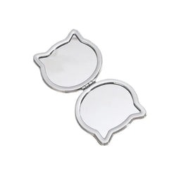 Upgrade your cosmetics collection with the Glitter Cat Pocket Double Sided Mirror. A leather looking base and a smiling feline face are covered by clear plastic, allowing for glitter to slide from side to side. It’s a little something pretty and a little something shiney to add a subtle boost to your day.