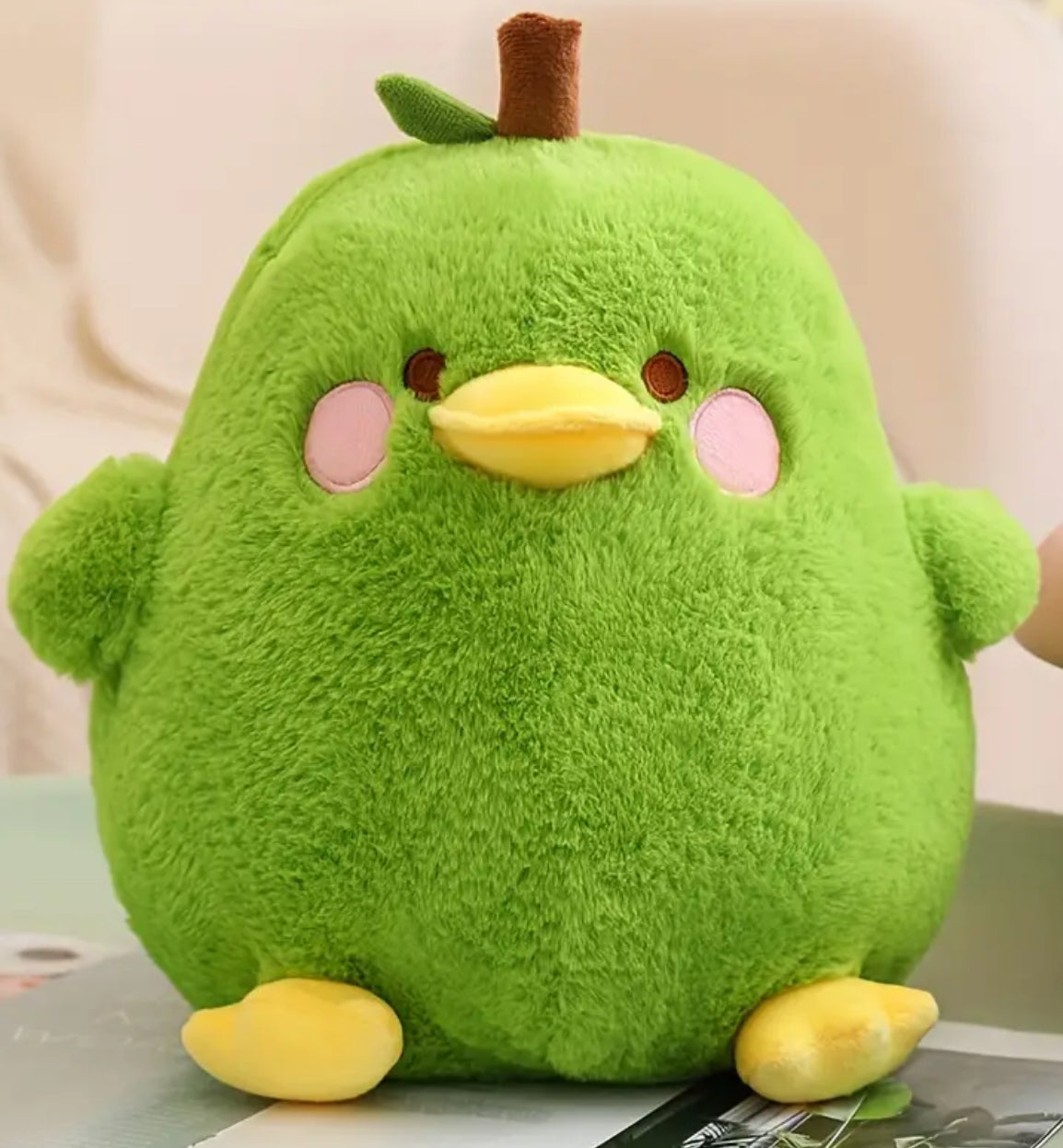 Our adorable Green Pear Chubby Duck Plushie is a charming fusion of humor, cuteness and comfort! This unique plushie features a soft, pear-shaped body with a delightful duck face and embroidered rosy cheeks, making it perfect for cuddling or as a decorative accent.