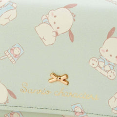 Add a touch of adorable charm to your daily essentials with this Green Pochacco Sanrio Gold Bow Wallet! Perfect for fans of the beloved Sanrio character, Pochacco, this wallet is as functional as it is cute.

Featuring Pochacco in a cool mint green design, the wallet is accented with a stylish gold bow and gold clasp, giving it a chic, feminine look.

Made from durable synthetic leather, with multiple compartments for cards, cash, and coins.