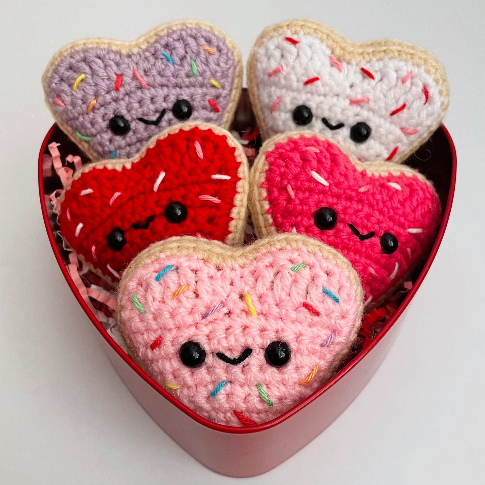 Indulge in sweetness with these Crocheted Heart-Shaped Sugar Cookies! Each cookie is lovingly crocheted with intricate detail, resembling the beloved classic treat.