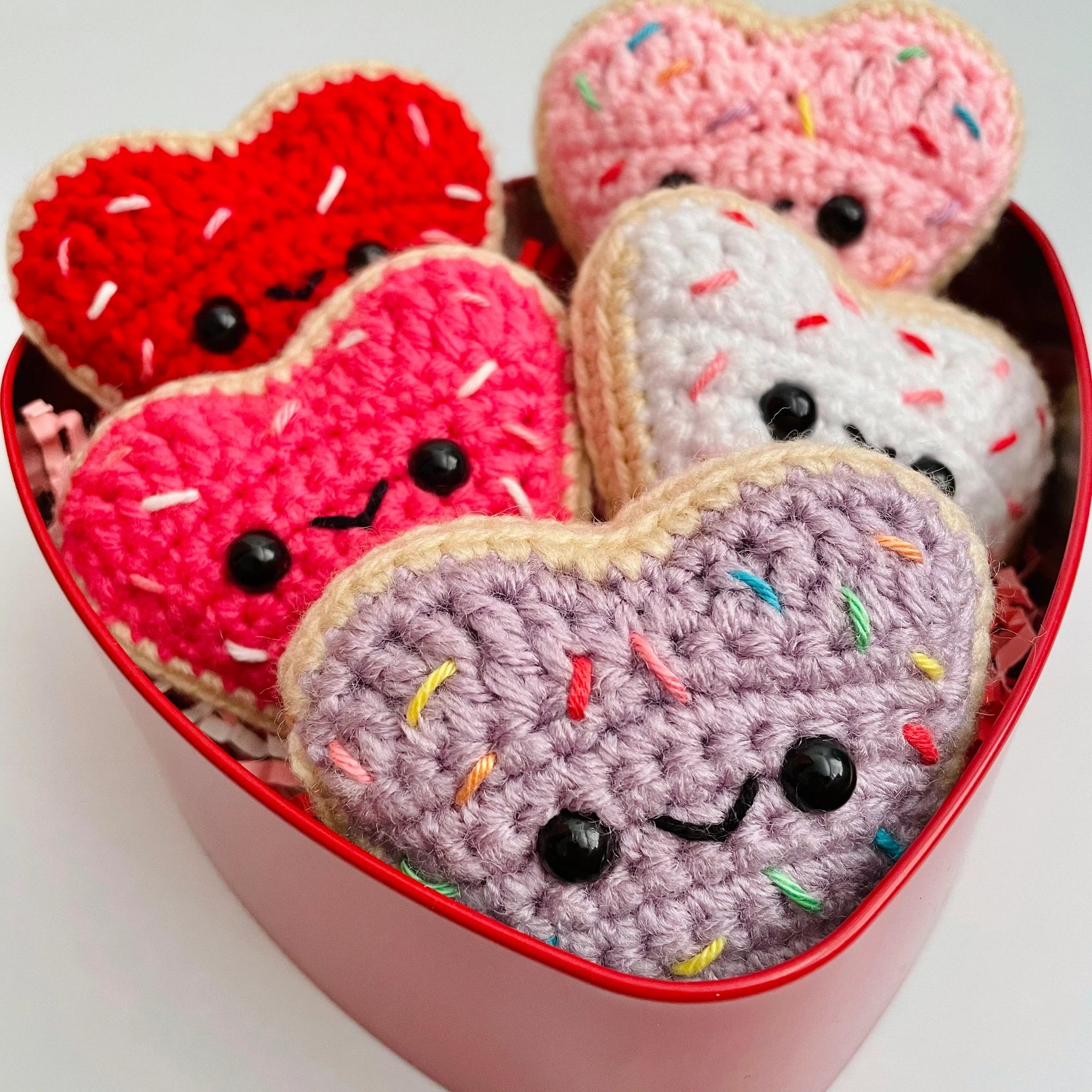 Indulge in sweetness with these Crocheted Heart-Shaped Sugar Cookies! Each cookie is lovingly crocheted with intricate detail, resembling the beloved classic treat.